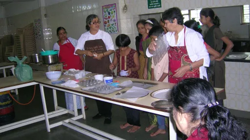 Nita and Laju demonstrating chocolate making