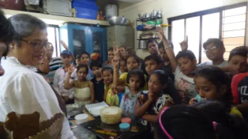 Nita teaching how to make chocolates