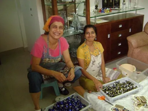 Nita with Deepa with chocolates in front of them